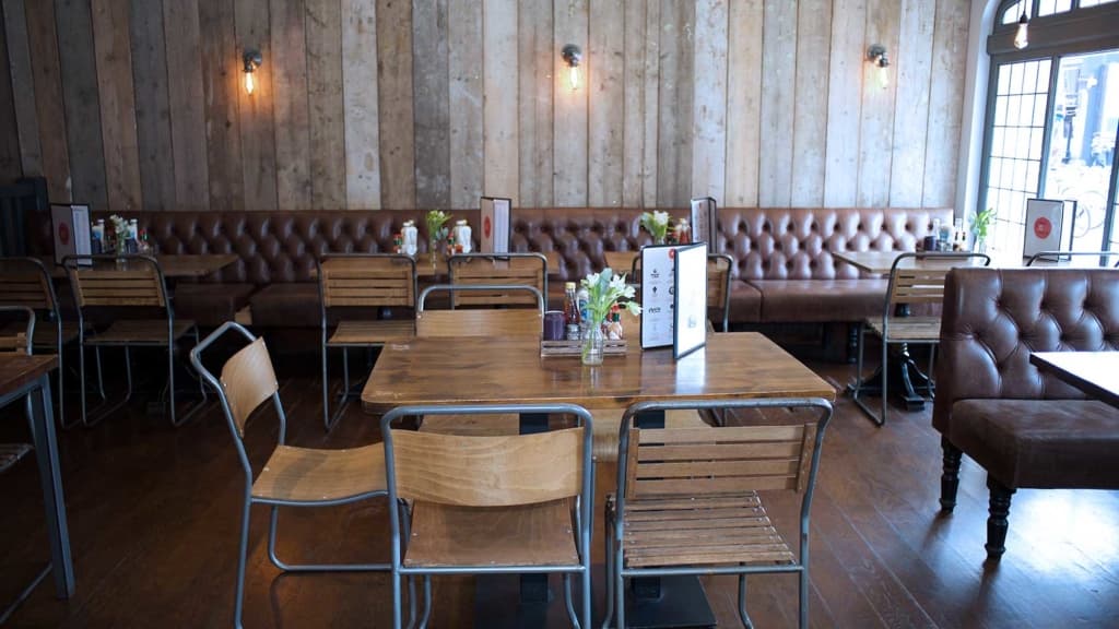 Refurbished dining room with new joinery, fitted seating and decorated walls