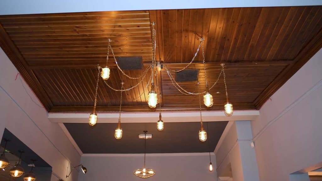 Decorative pendant lighting installed over a bar counter