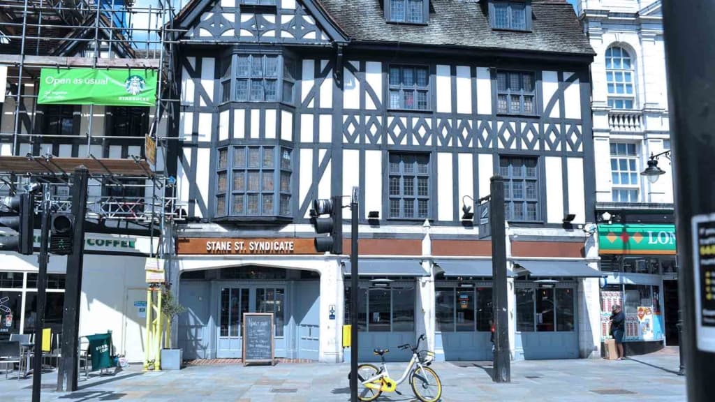 Exterior of a refurbished venue with repainted frontage and new signage